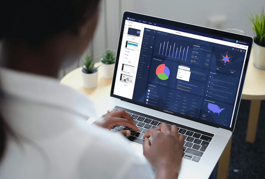 Marketer reviewing demo analytics on a laptop